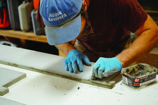 The author fills pinholes using a paste of cement, pozzolan, and acrylic fortifier.