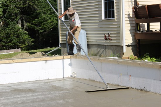 I sent the pump truck on its way and started to bull-float the surface.
