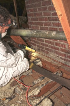 Craftsman Chris Jerome first laid a bead of high-temperature sealant on the masonry.