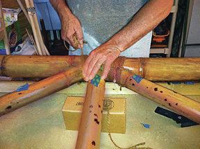 Lashings of chocolate-colored natural hemp cordage hold the rail pieces together.