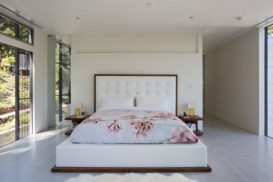The open and clean addition of the remodel is perhaps best exemplified by the master suite with adjoined "wet room" that is separated by a pocket door. &nbsp;