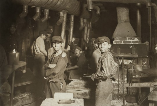 Photos by Lewis Hine, including "Glassworks. Midnight." (shown here), drew attention to child labor in industry at the turn of the last century and set in motion radical education reforms. What often gets lost in the reaction to the unsafe and unhealthy working conditions for children, is the effective transfer of knowledge from one generation to the next. The active involvement of children working with their parents and relatives is what kept craft alive in the late 19th and early 20th centuries.  (Library of Congress)