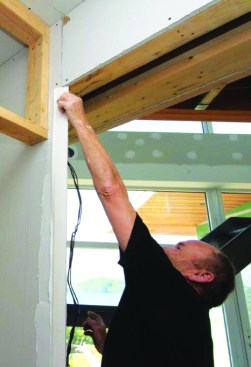 With the compound shaped to his liking, he installs a No-Coat 450 Flex corner
bead, pressing it firmly into the compound.