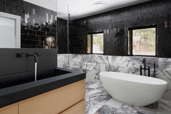On this high-end bathroom gut remodel, the author said, "I wish this job had been cost-plus. This job was early on in my career and it took hundreds of hours to complete. Cost-plus shines on jobs like this where we have a lot of high-end details and fixtures that we had never done before. Instead of relying on my guess for how long it should take, we could have simply been tracking our hours and billing for them."