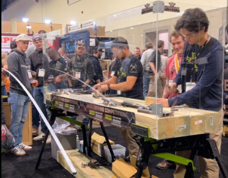 A nail-driving competition on the expo floor exemplifies the high-energy combo of fun and learning to be found at JLC Live.   (Photo: Nicole Tysvaer)