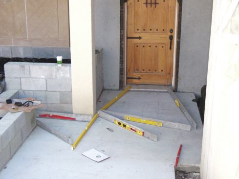 Before installing the mortar bed, survey the topography of the slab to find low and high spots.