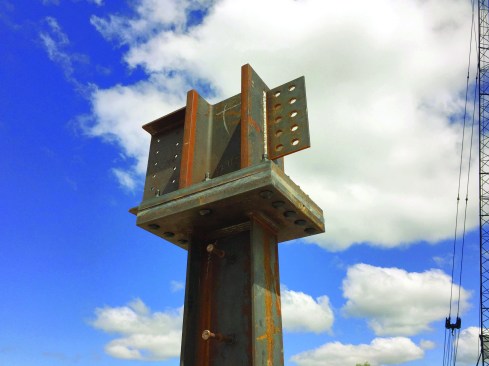 A 1-inch-thick fiberglass thermal isolation pad at the column-to-beam connection adds insulation value of R-2—not much but still significant compared with ordinary steel.