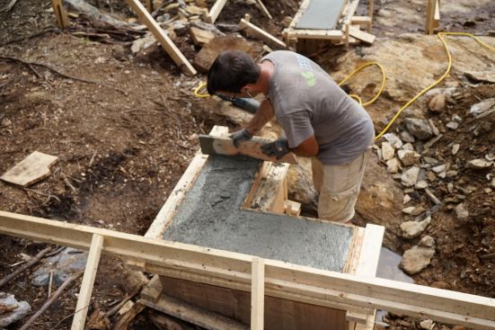 The crew places concrete and frames up stemwalls.