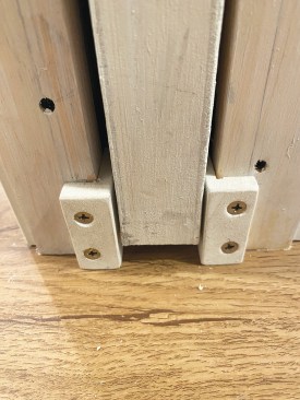 Plastic guides are included with the pocket-door kit, but the author made his own guide blocks out of scrap PVC that provided a better fit and more durability.