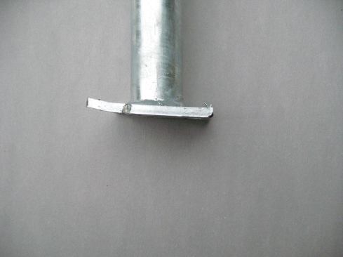 When the EZ Post was fastened with 7/16-inch-diameter bolts and regular washers to doubled-up blocks that ran perpendicular to the rim joist, the washers and nuts began to pull through the blocking as soon as force was applied; at 373 lb., the blocking split, with more than a foot of deflection. When reinforced with another system’s base plate, the assembly was able to handle 500 lb. of tension, though the mounting plate bent