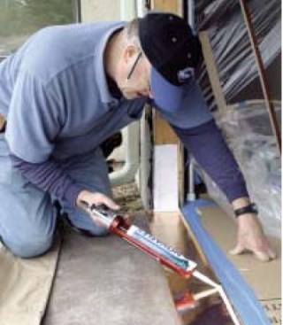 In preparation for the jamb, beads of sealant are applied to the
pan ...