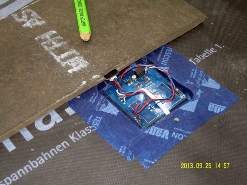 A closeup view of the moisture sensor installed in the Homasote sheathing for an unvented flat roof in rural Vermont.