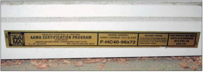 On this AAMA label, F-HC40-96x72 is the critical designation for this window. F is the product type (Fixed); HC is the performance class (Heavy Commercial); 40 is the performance grade (40 psf design pressure); and 96x72 is the maximum size tested (width x height).