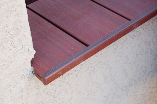 Installing a trim detail is faster and less expensive than installing a border. The trim is ripped from nongrooved decking, then glued and either screwed or nailed in place.