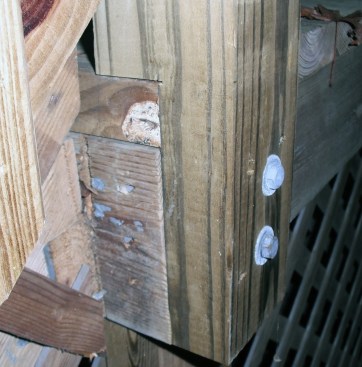 Guard posts that have been notched around the framing may develop cracks originating  in the corner of the notch and running parallel to the grain. Notching weakens a post, and should be avoided.