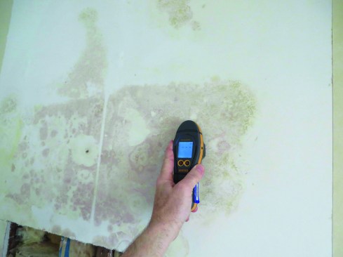 Parts of the wall that were opened up were able to dry to the inside and were quite dry when the authorchecked them. Removing the rest of the vinyl wallpaper addressed the problem satisfactorily.