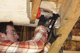 Paslode’s new nailer is short enough top-tobottom to fit in a 12-inch joist bay.

