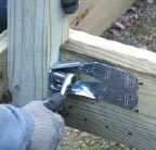 Several manufacturers produce hardware designed to withstand the loads imposed by railing posts. Shown here is a Simpson Strong-Tie DTT2.