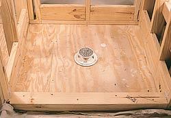 A clamp ring drain is set (but not fastened) to the subfloor.