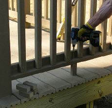Figure 13. Pieces of 2x2 support the railing midspan. Composite-railing manufacturers generally require this, and it's a good idea with wood railings as well.