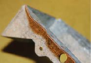 Figure 4. Framing hardware is stamped from galvanized sheet, and the edges are raw steel. Galvanization offers some protection to the edges, but it’s imperfect, as evidenced by the light layer of rust on this joist hanger.
