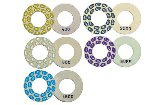 The final polishing discs look like they have colored jelly beans glued to them.