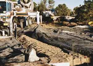 If there is any chance of freezing, blankets are used to protect the subgrade before placing the slab.