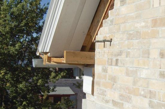 The masons who laid up the brick veneer left us with pairs of protruding anchor bolts.