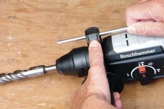 On some rotary hammers, you have to loosen the side handle to adjust the depth stop — but the Xtreme Max has a convenient release button. The tool features rotary-only, rotary-hammer, and hammer-only modes.
