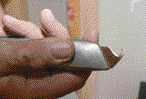 Cuts are made with a hook-blade utility knife.