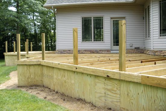 Plywood forms the substrate for the stone fascia.