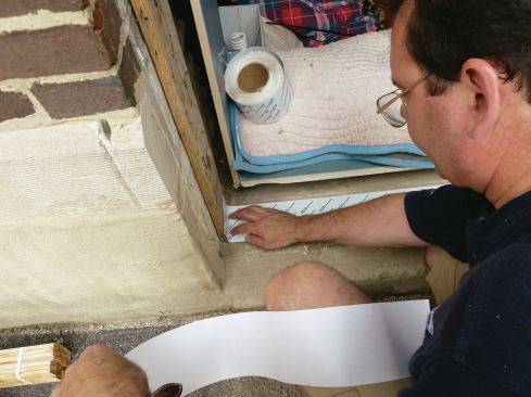 A window buck made from untreated 2-by stock provides a nailing base for the new window. Peel-and-stick flashing tape isolates the buck from the masonry sill.