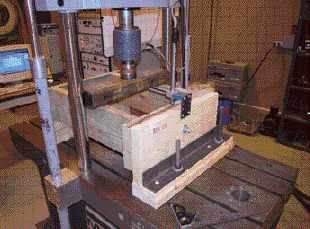 Figure 1. Researchers at Virginia Tech used this hydraulic apparatus to test the strength of various ledger-to-house connections.