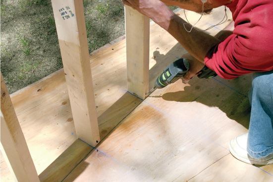 Straight, wane-free studs screwed to the plywood templates behind each riser line provide a bending form.
