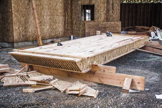 To set up for gang-cutting, we stack joists of the same length side by side on racks we build from 2x12s braced on edge.