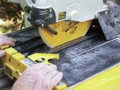 CHECK BLADE TRACKING AND FENCE 

Using the combination square, make sure the blade is parallel to the sliding table (3). Check at the beginning as well as the end of the table’s travel. Then adjust the saw’s fence so that it is square to the table and blade (4).