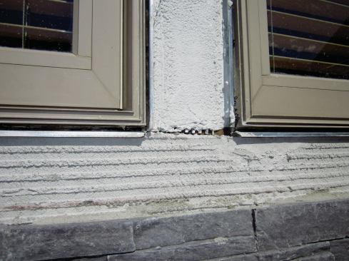 Along window jambs and sills we install metal casing bead, spaced about 3/8-inch from the window flange.