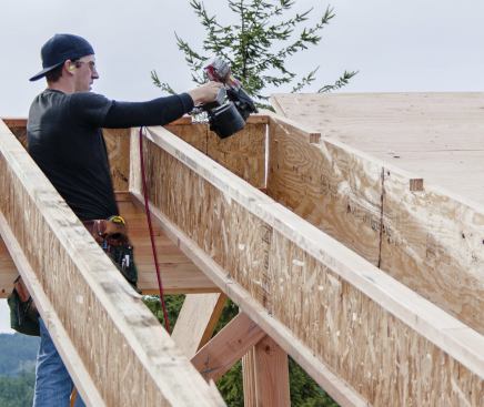 Blocking above the ridge is required in this situation (L), but before installing it you need to decide how the rafters on each side of the ridge will be joined.