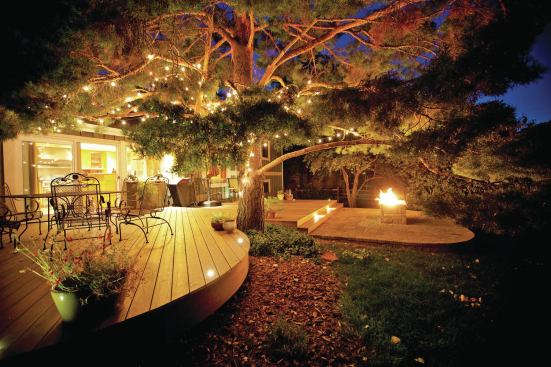 This deck and patio, built by Banell Custom Decks in Parker, Colo., can be enjoyed late into the night.