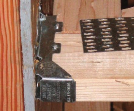 The gap at the end of this floor truss is a framing violation. Any truss or joist must have full bearing on the hanger seat.  (photo: Jim Mattison)