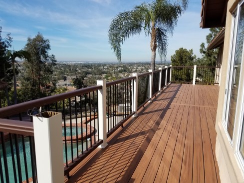 The nearly-completed deck perfectly complements the nearby landscape.