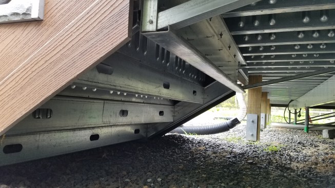 The author modified the original Paverdeck stair framing design, beefing it up with boxed galvanized LGS stringers and joists.