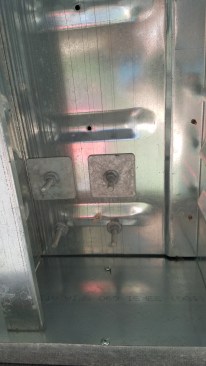 The through-bolts that attached the posts through the stone treads to the Paverdeck pans were backed with large washers.