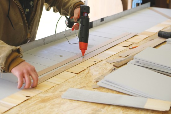 ... and glues on the shims.