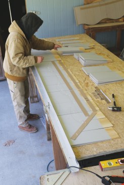 Each successive course of shingles is butted up against the straightedge ...