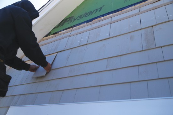 Wide shingles simplify the two-course transition between installed shingles and the base-course shingles before the wave pattern starts.