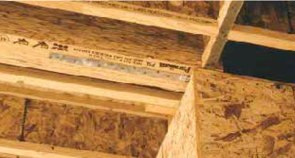The strap in the photo above carries tension forces from the collector truss to the shear wall beyond (lower left in the photo).