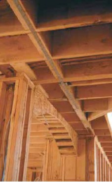 This strap was installed from the top before the floor sheathing was nailed down.
