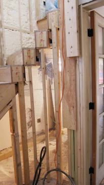 After closing in the exterior wall, each box was fastened to studwall. The curved wall was lathed …