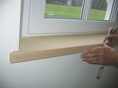 The nosing overhangs the flared sides 1 1/2 inches on each side. I cut the maple to length, then placed it against the Baltic birch, mindful to maintain the overhang, and drew registration marks that would allow me to align plate-joiner cuts.